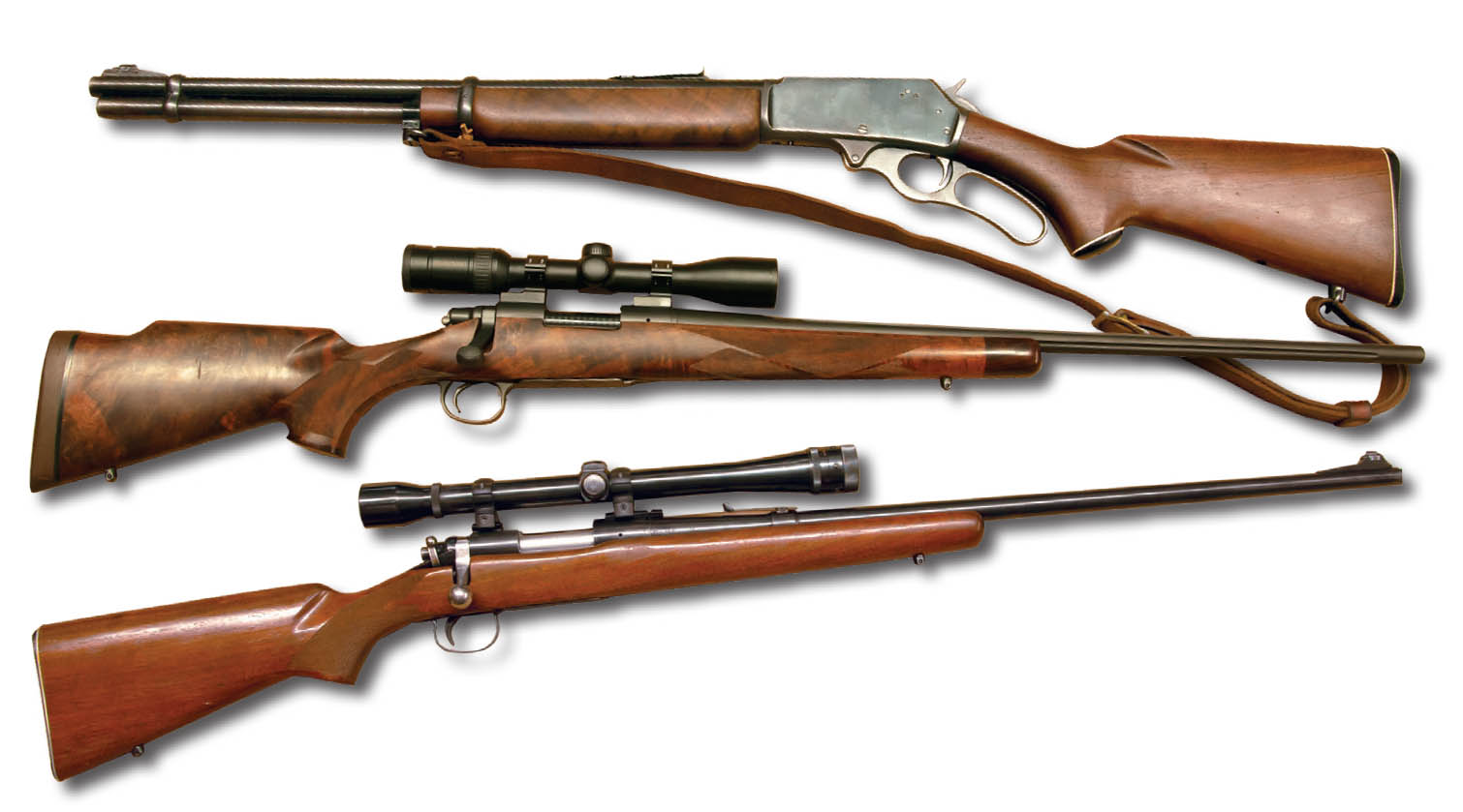 These rifles include (top to bottom) a cherished 1958 Marlin 336 .30-30, a Remington Custom Shop Model 700 6.5 Remington Magnum with a Swarovski Z3 3-9x 36mm scope and a Remington Model 722 .222 Remington with a Weaver K10 scope.